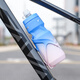 40,000 kilometers bicycle water bottle cradle gradient color mountain road bike water bottle water cup holder cycling equipment blue pink
