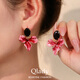 Qlady iris flower earrings female temperament high-end red earrings women 2025 new light luxury silver needle earrings birthday gift
