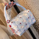 2025 new high-value makeup storage bag large capacity portable washing and storage three-dimensional travel makeup handbag blue pleated puppy handbag