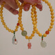 Fat Donglai's same style beeswax bracelet chicken fat yellow beeswax bracelet 5mm round beads women's silver plated ancient gold lotus pod south red beeswax lotus pod bracelet S