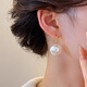 Qi Xiaomi large Shijia pearl earrings women's earrings 2025 new high-end light luxury earrings temperament round face earrings a pair of white large pearl earrings the same style as Liu Shishi