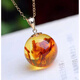 Extravagant 18k gold inlaid with natural flower amber 14mm round bead pendant for women amber transfer beads small ball versatile necklace clavicle chain