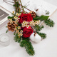 The first snow in winter, roses and pine cones mixed flowers are perfect for Christmas
