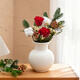 The first snow in winter, roses and pine cones mixed flowers are perfect for Christmas