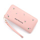 Portefeuille féminin simple en tissu long Zipper à la mode portefeuille brodé 2024 European et américain de grande capacité en cuir souple maintient le sac de téléphone mobile rose