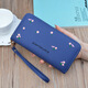 Portefeuille féminin simple en tissu long Zipper à la mode portefeuille brodé 2024 European et américain de grande capacité en cuir souple maintient le sac de téléphone mobile rose