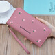 Portefeuille féminin simple en tissu long Zipper à la mode portefeuille brodé 2024 European et américain de grande capacité en cuir souple maintient le sac de téléphone mobile rose