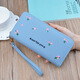 Portefeuille féminin simple en tissu long Zipper à la mode portefeuille brodé 2024 European et américain de grande capacité en cuir souple maintient le sac de téléphone mobile rose