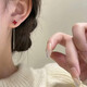 Mansheng red four-leaf clover tassel earrings for women 2026 new high-end light luxury niche unique simple temperament earrings pair