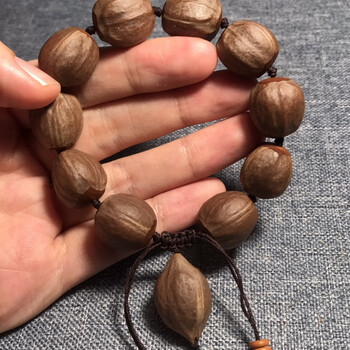 素核橄榄核手串  天然紫肉橄榄核素核手串原籽伴生福