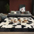 法绒羚卡 巴西进口高级牛皮拼接客厅地毯大尺寸黑白方块格子沙发毯茶几垫现代简约轻奢办公室客厅卧室床边毯 奇格18T 1.6米x2.3米【手工现做】